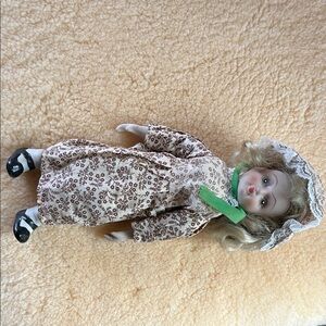 Porcelain Doll with Brown Floral Dress and Lace Bonnet